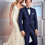 Bride in lace dress, groom in navy tuxedo