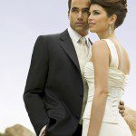 Bride and groom posing outdoors
