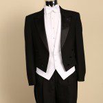 Black tailcoat tuxedo with white waistcoat