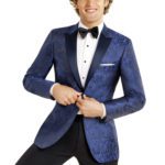 Smiling man in blue patterned tuxedo jacket