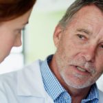 Researchers discussing results in laboratory setting